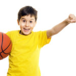 Young boy holding a Basketball - isolated